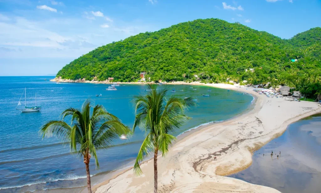 Yelapa beach and village along the green coastline