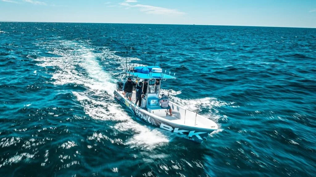 Sportfishing boat running through the open ocean